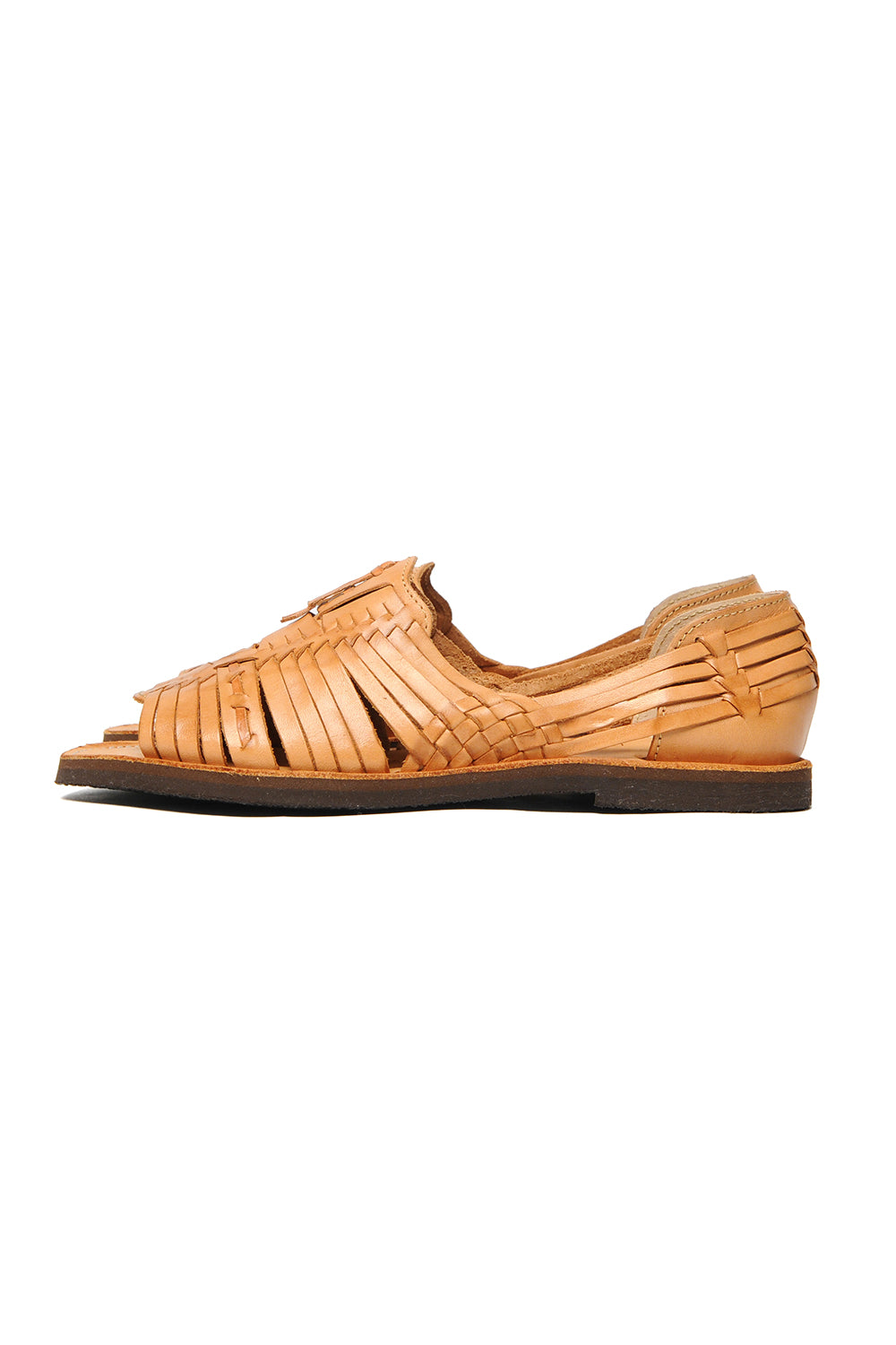 Side view of women’s leather slip-on Chamula huarache with woven design
