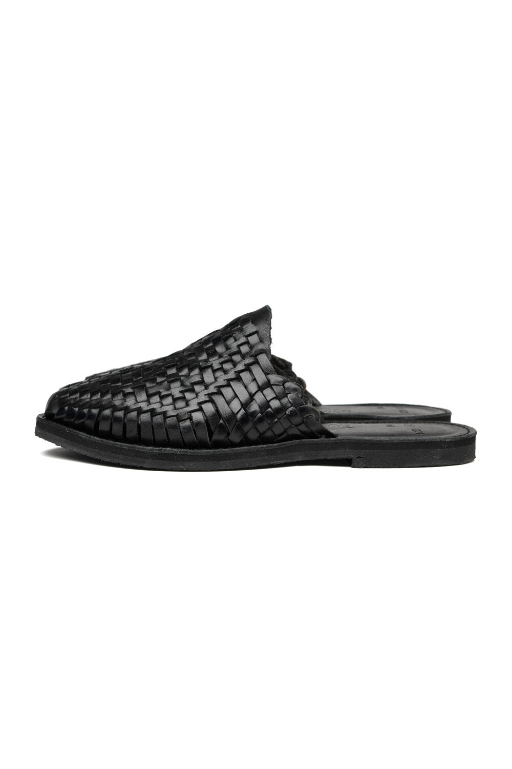 Side view of women’s Chamula leather slip-on huarache with woven design