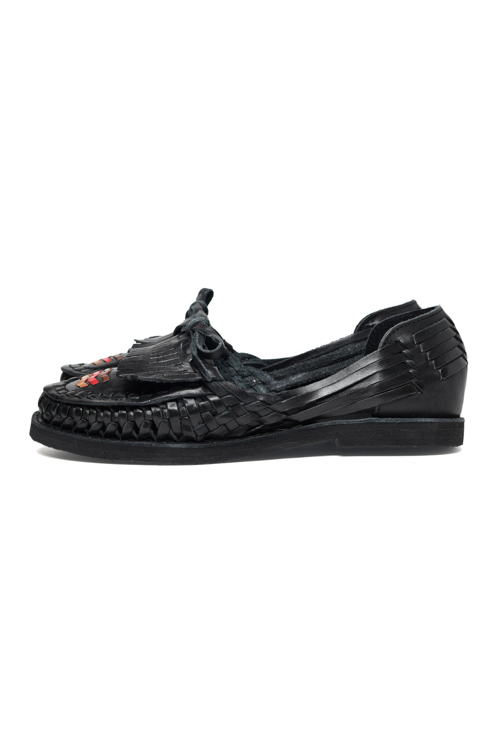 Side view of women’s Chamula leather slip-on huarache with woven design