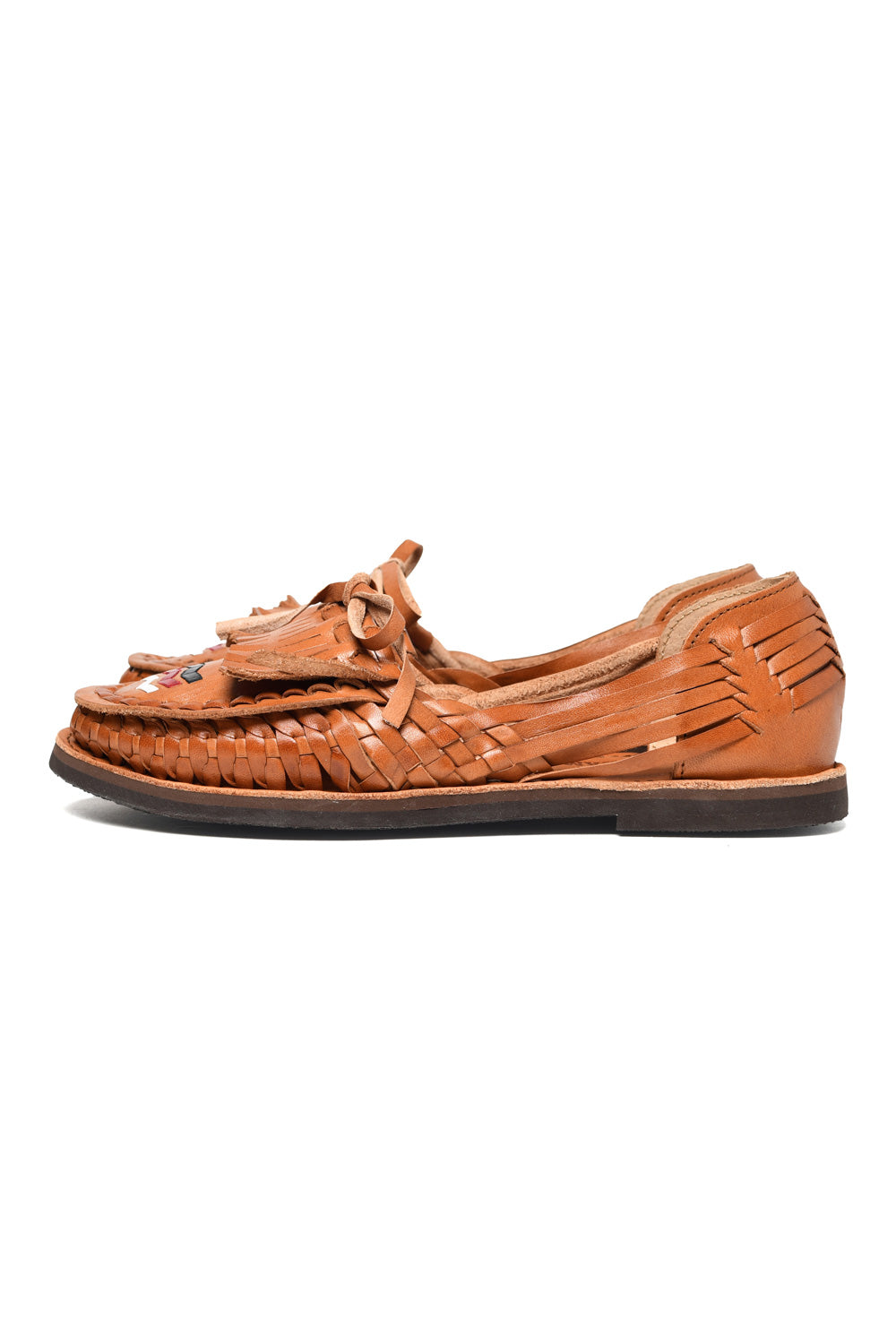 Side view of women’s Chamula leather slip-on huarache with woven design