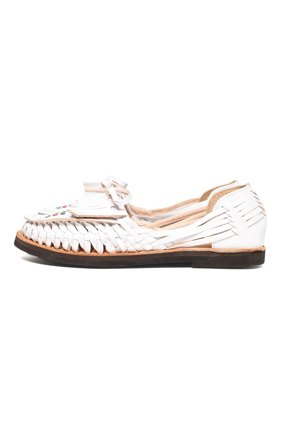 Side view of women’s Chamula leather slip-on huarache with woven design